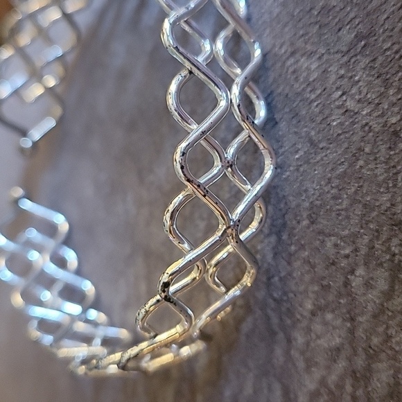 3/$30 Silvertone Braided Wave Cuff Bracelet - Picture 3 of 5